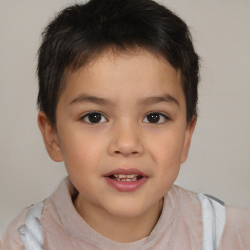 Joyful white child male with short  brown hair and brown eyes