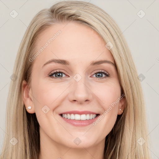 Joyful white young-adult female with long  brown hair and blue eyes