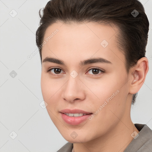 Joyful white young-adult female with short  brown hair and brown eyes