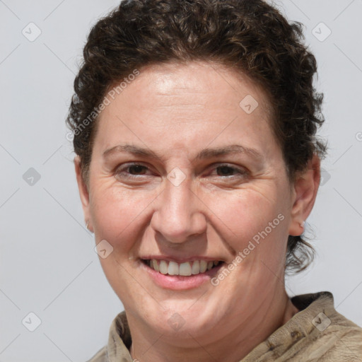 Joyful white adult female with short  brown hair and brown eyes