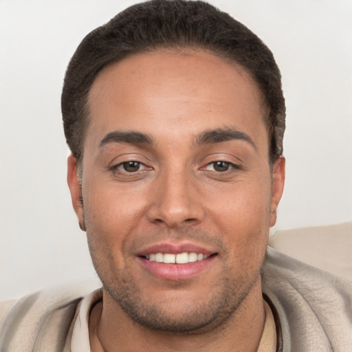 Joyful white young-adult male with short  brown hair and brown eyes