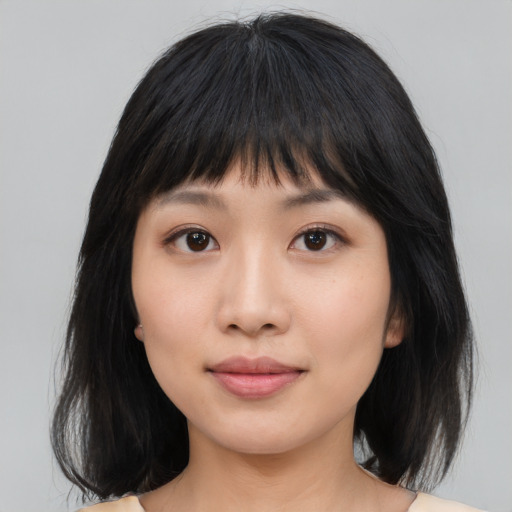 Neutral asian young-adult female with medium  black hair and brown eyes