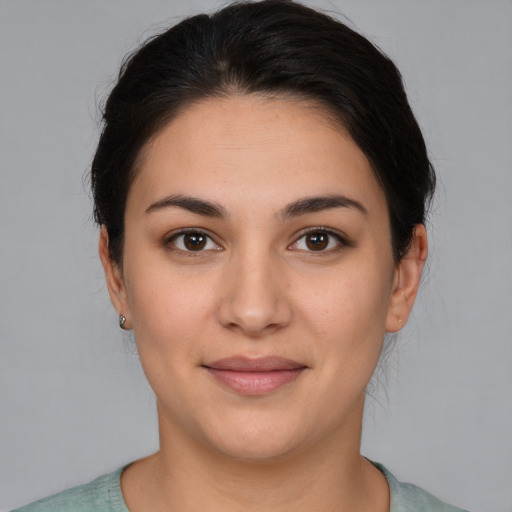 Joyful white young-adult female with medium  brown hair and brown eyes