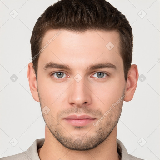 Neutral white young-adult male with short  brown hair and grey eyes