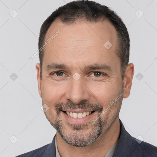 Joyful white adult male with short  brown hair and brown eyes