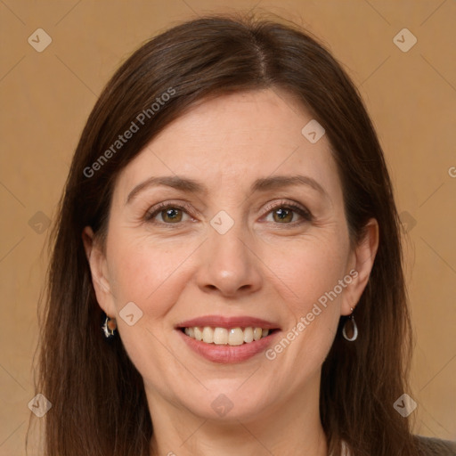 Joyful white adult female with long  brown hair and grey eyes