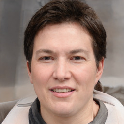 Joyful white adult male with short  brown hair and grey eyes