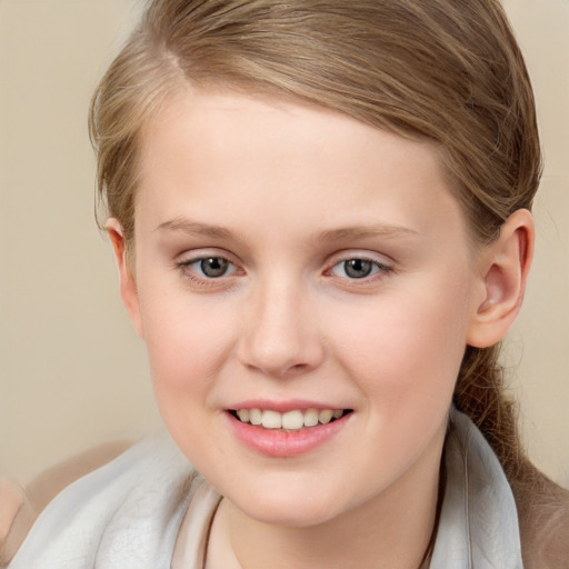 Joyful white child female with medium  brown hair and brown eyes