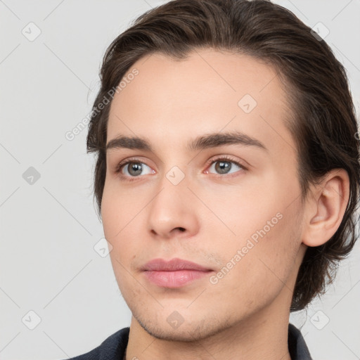 Neutral white young-adult male with medium  brown hair and brown eyes