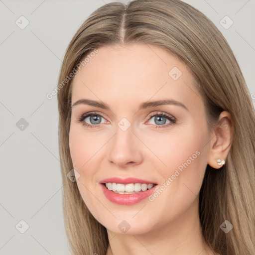 Joyful white young-adult female with long  brown hair and grey eyes