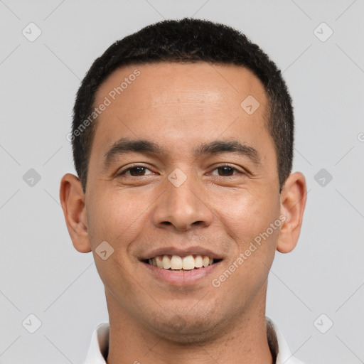 Joyful latino young-adult male with short  black hair and brown eyes