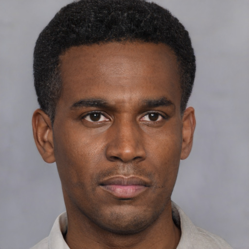 Neutral black young-adult male with short  black hair and brown eyes