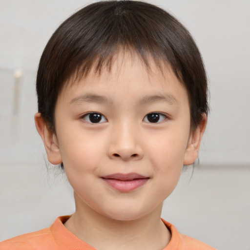 Joyful white child female with short  brown hair and brown eyes