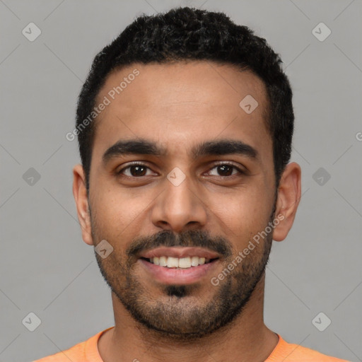 Joyful latino young-adult male with short  black hair and brown eyes