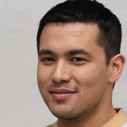 Joyful white young-adult male with short  black hair and brown eyes