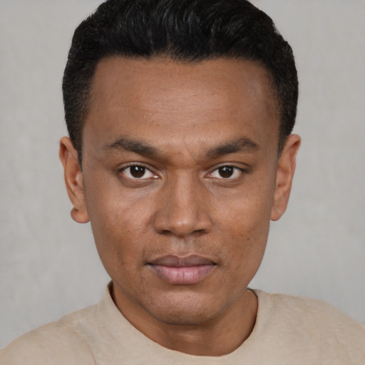 Neutral black young-adult male with short  black hair and brown eyes
