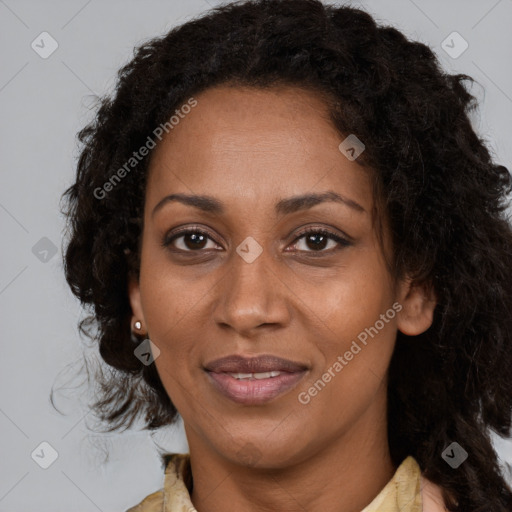 Joyful black adult female with medium  brown hair and brown eyes