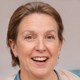 Joyful white middle-aged female with medium  brown hair and brown eyes