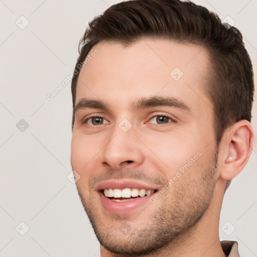 Joyful white young-adult male with short  brown hair and brown eyes