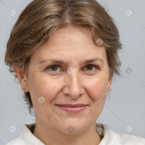 Joyful white adult female with medium  brown hair and brown eyes