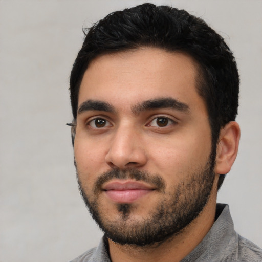 Neutral latino young-adult male with short  black hair and brown eyes