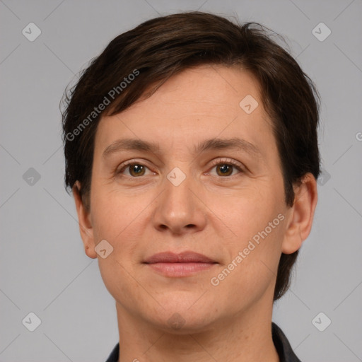 Joyful white adult female with short  brown hair and grey eyes