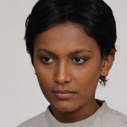 Neutral black young-adult female with short  black hair and brown eyes
