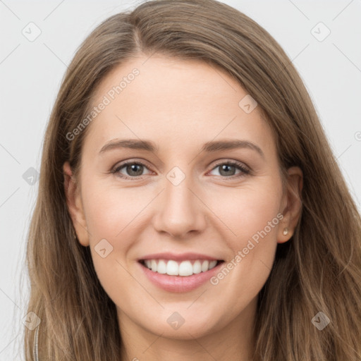 Joyful white young-adult female with long  brown hair and grey eyes