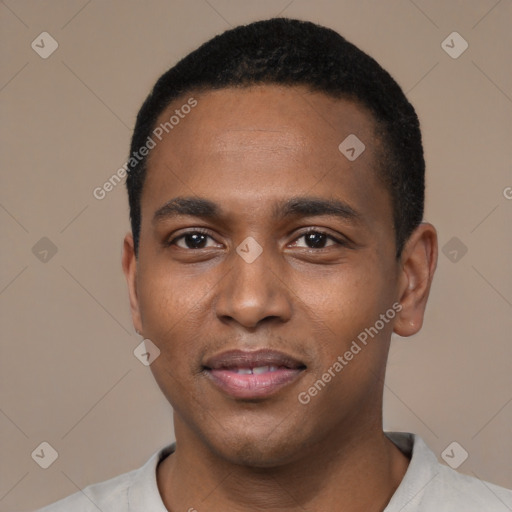 Joyful black young-adult male with short  black hair and brown eyes