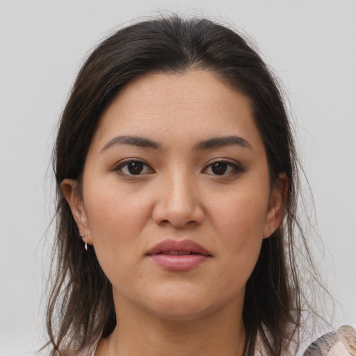 Joyful asian young-adult female with medium  brown hair and brown eyes