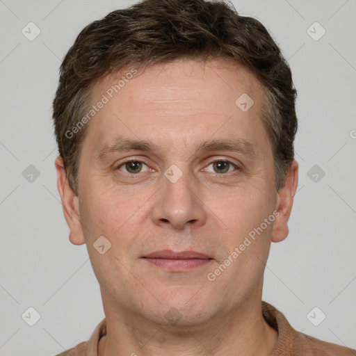 Joyful white adult male with short  brown hair and grey eyes