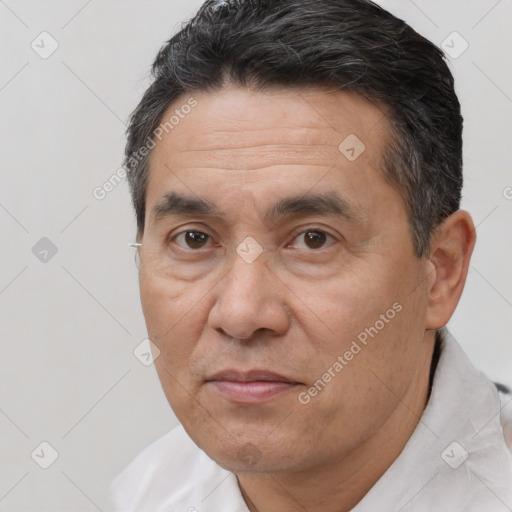 Joyful white adult male with short  brown hair and brown eyes