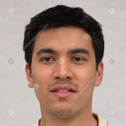 Joyful white young-adult male with short  black hair and brown eyes