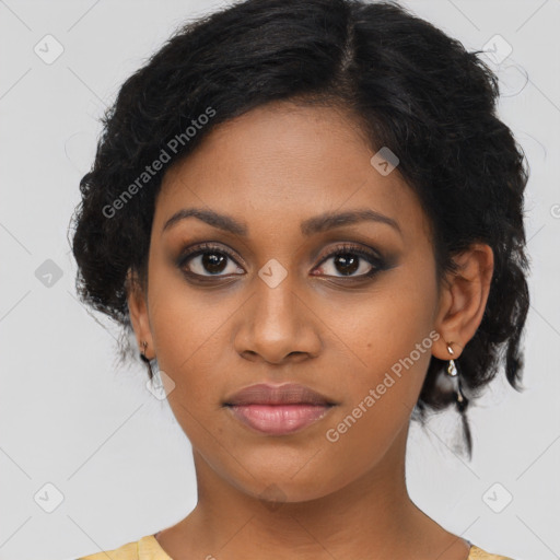 Joyful black young-adult female with medium  brown hair and brown eyes