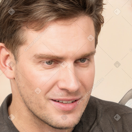 Joyful white adult male with short  brown hair and grey eyes