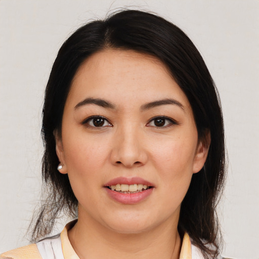 Joyful white young-adult female with medium  brown hair and brown eyes
