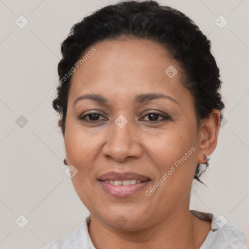 Joyful latino adult female with short  brown hair and brown eyes