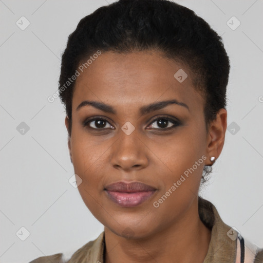 Joyful black young-adult female with short  brown hair and brown eyes