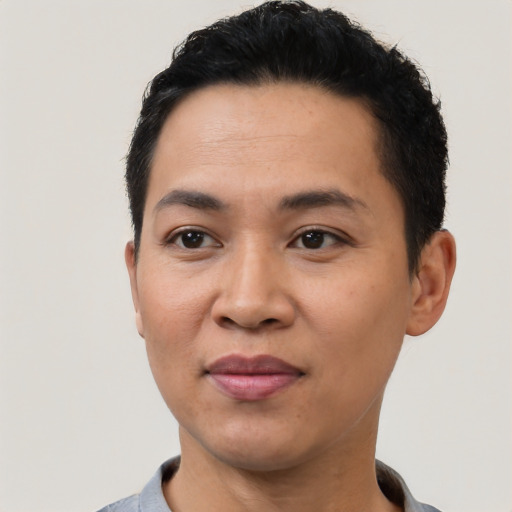 Joyful latino young-adult female with short  black hair and brown eyes