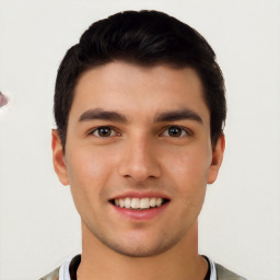 Joyful white young-adult male with short  black hair and brown eyes