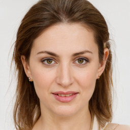 Joyful white young-adult female with medium  brown hair and green eyes