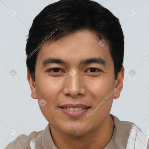 Joyful asian young-adult male with short  brown hair and brown eyes