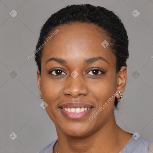 Joyful black young-adult female with short  black hair and brown eyes