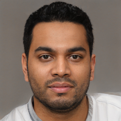 Neutral latino young-adult male with short  black hair and brown eyes