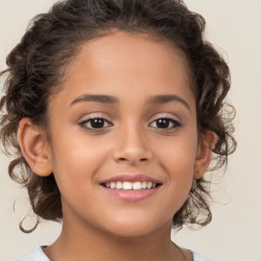 Joyful white child female with medium  brown hair and brown eyes