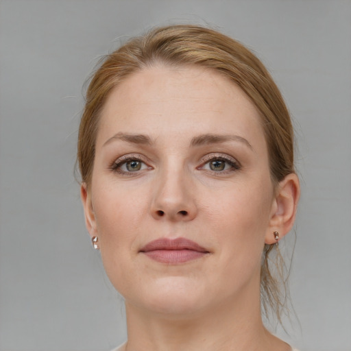 Joyful white young-adult female with medium  brown hair and blue eyes