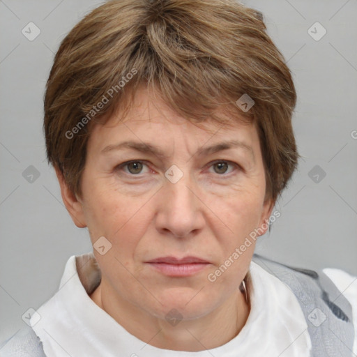 Joyful white adult female with short  brown hair and grey eyes