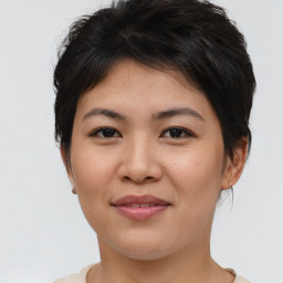 Joyful asian young-adult female with short  brown hair and brown eyes