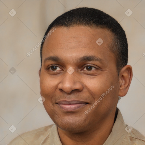 Joyful latino adult male with short  black hair and brown eyes