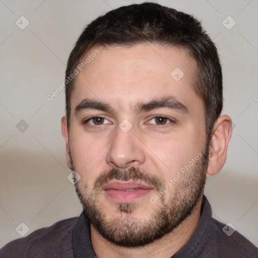 Joyful white adult male with short  black hair and brown eyes